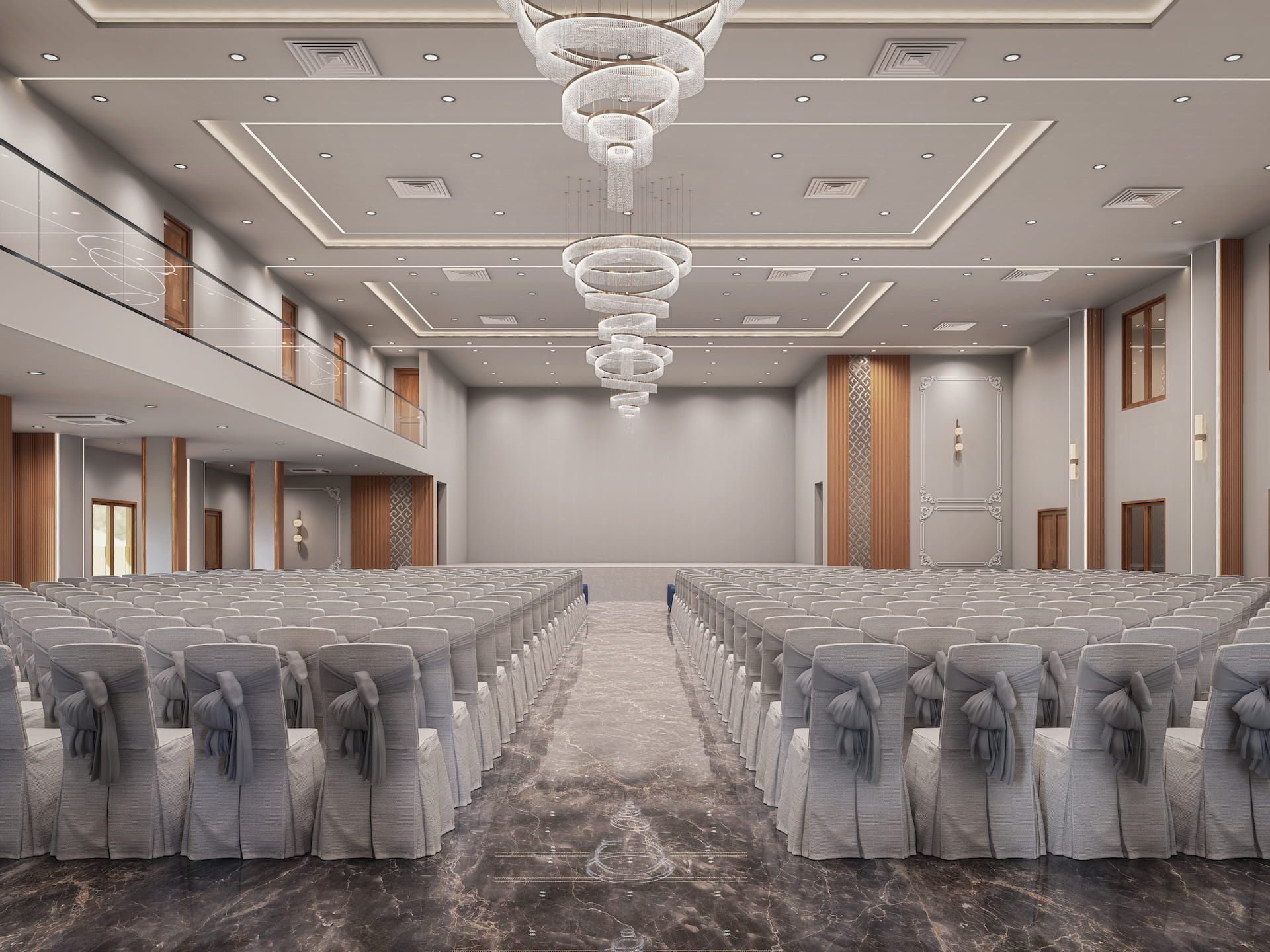 Luxury function hall interior with elegant chandeliers, marble flooring, and neatly arranged seating.
